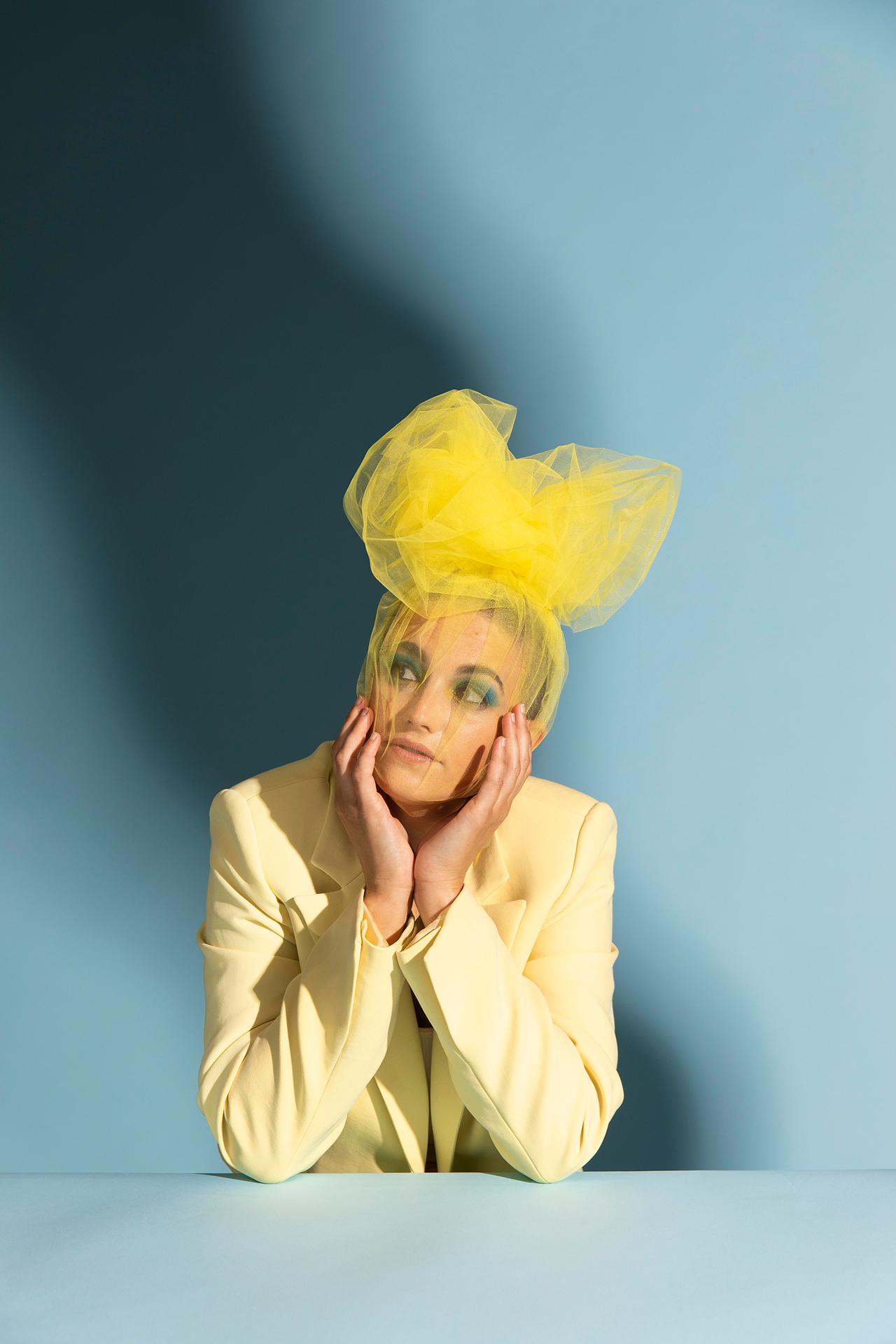Orvian campaign portrait in a yellow suit