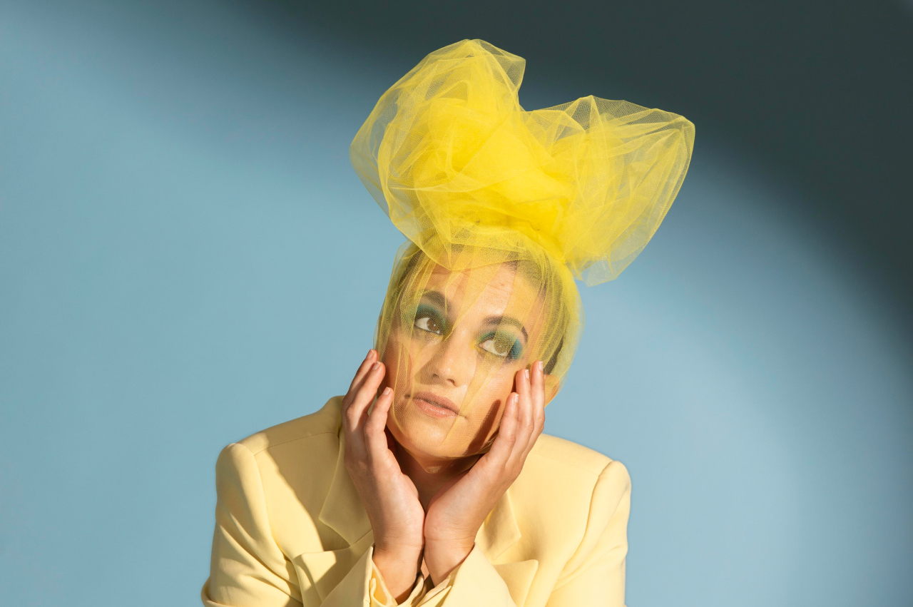 Orvian campaign portrait with yellow headpiece