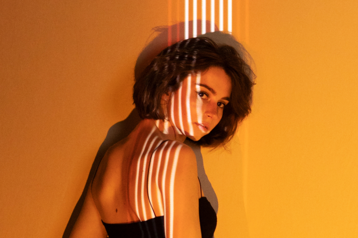 Solara portrait in warm amber lighting