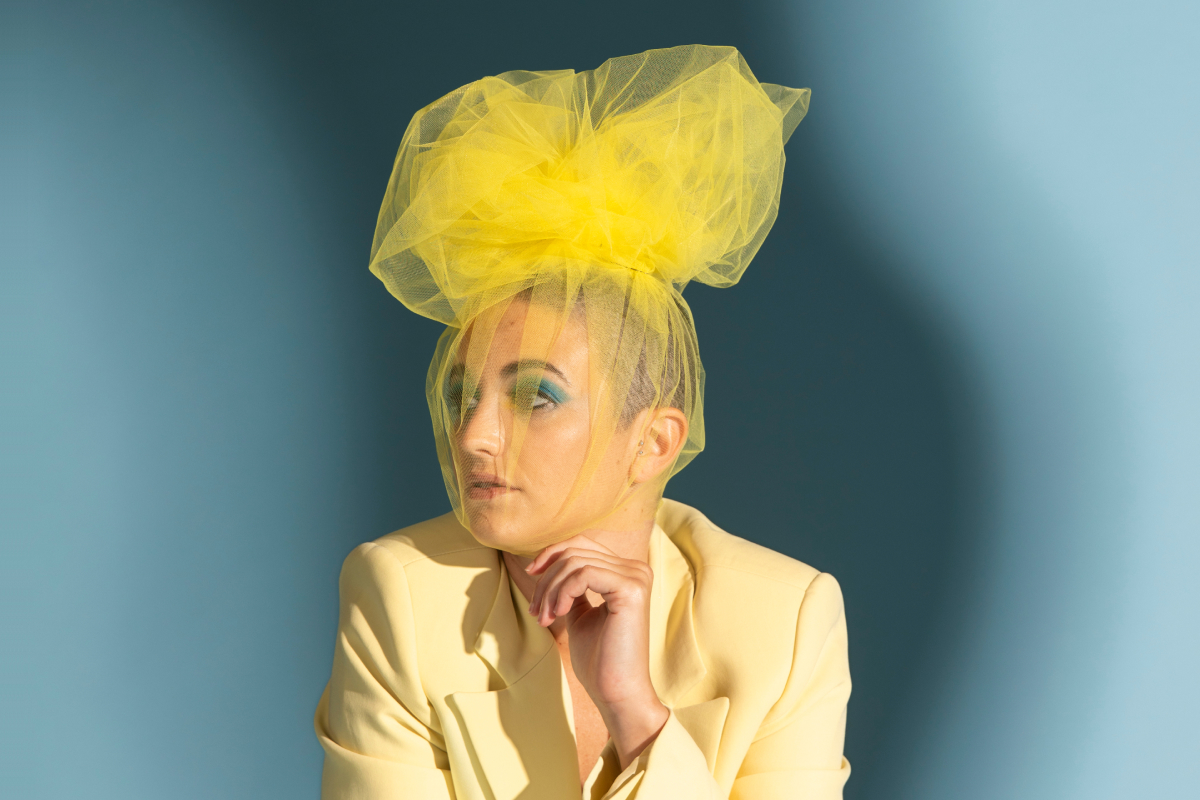 Orvian campaign portrait with yellow headpiece